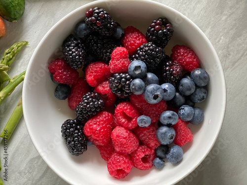 Home-cooked meal and preparations. Vegetables, Berries,  and sauce.