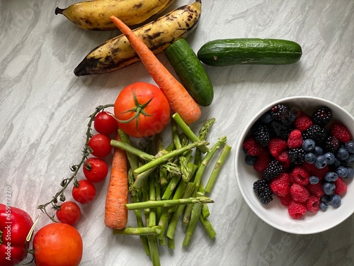 Home-cooked meal and preparations. Vegetables, Berries,  and sauce.