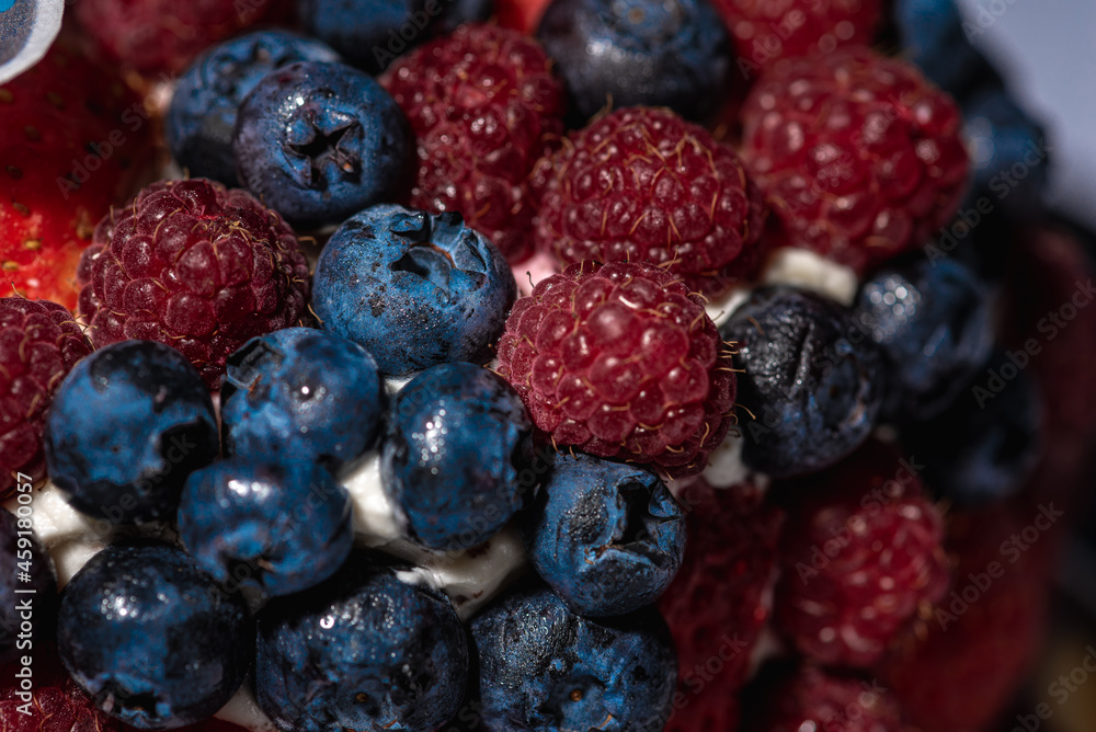 top view of cake with berries, blueberries, strawberries on a light background, close up view. Summer berry cake concept top view of cake with berries, blueberries, strawberries on a light background, close up view. Summer berry cake concept