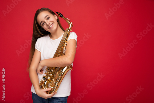 Photography Shot of attractivehappy smiling brunette little girl wearing white t-shirt for m