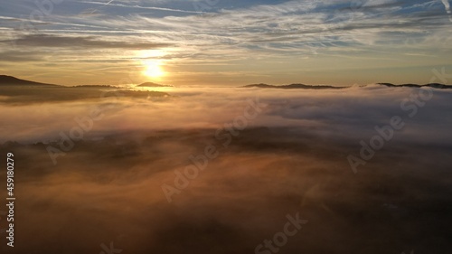 Rolling fog clouds during a morning sunrise