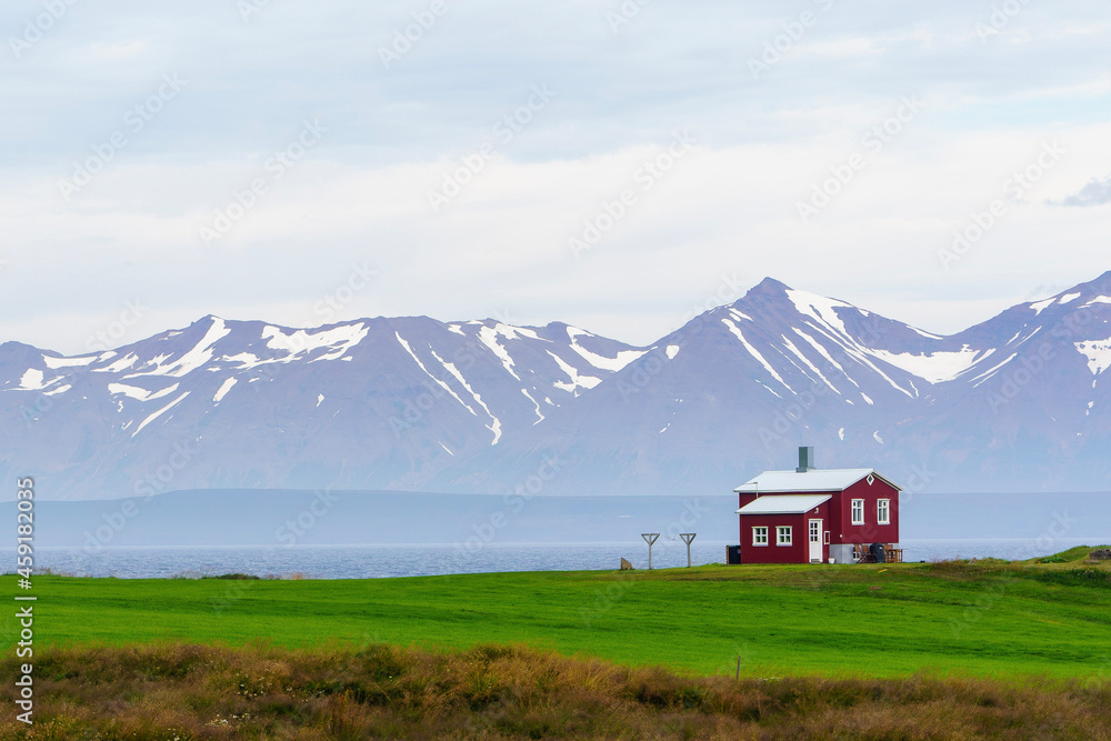red Icelandic house by the sea