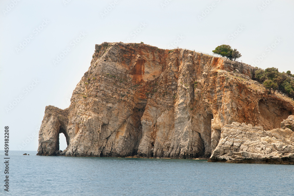 rock with the grotto in the sea