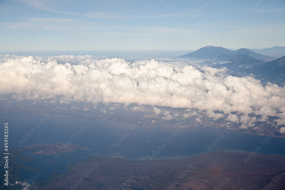 Mountain peaks of Indonesia, the view from the plane. Volcanoes of Indonesia, view from the plane. Mountain peaks of Indonesia, the view from the plane. Volcanoes of Indonesia, view from the plane.