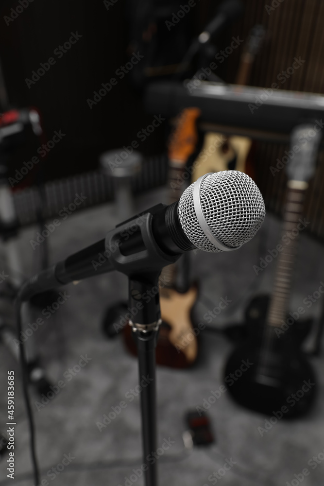 Modern microphone at recording studio. Music band practice Modern microphone at recording studio. Music band practice