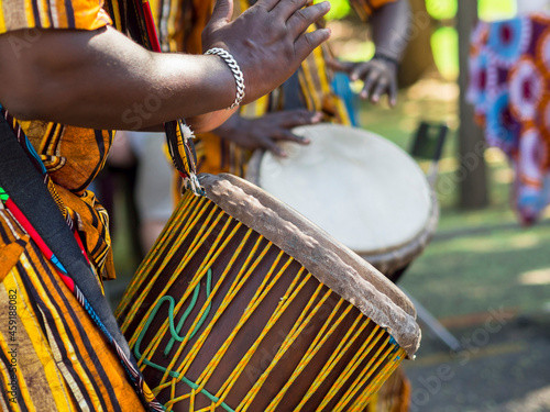 African man's hands playing the African drum. Musical culture. photo