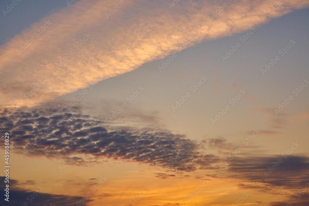 Colorful sunset sky with clouds as a background.