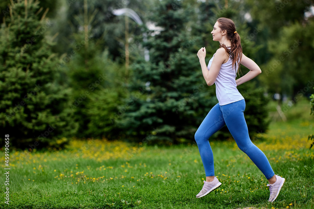 Scamper by slender european woman in public park. Scamper by slender european woman in public park.