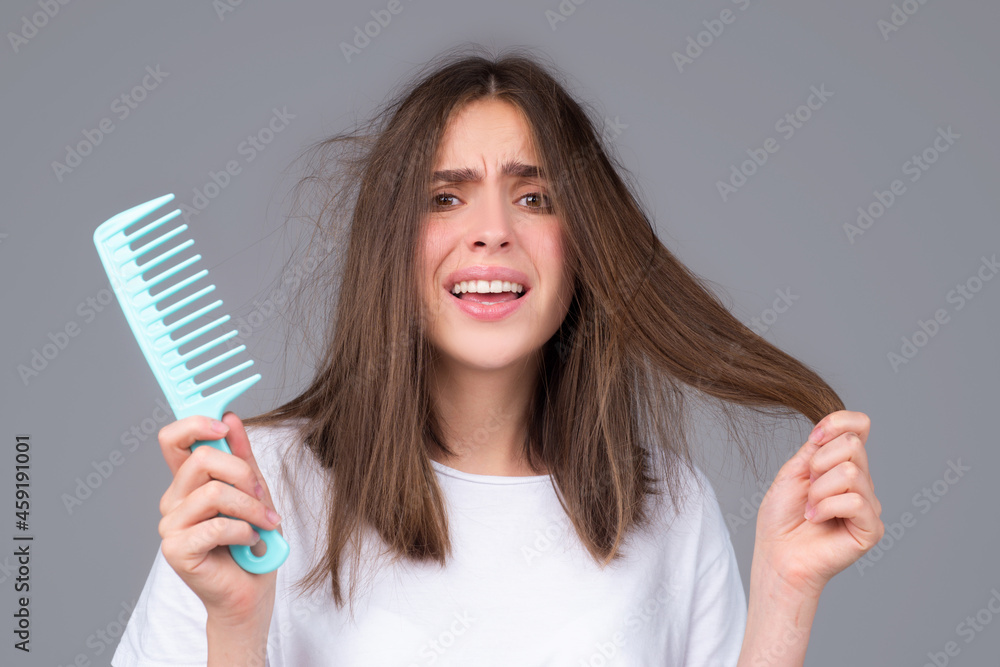 Hair care. Straightening woman and treatment of the hair. Girl with straight brushed hair. Hair tangling problem. Hair care. Straightening woman and treatment of the hair. Girl with straight brushed hair. Hair tangling problem.