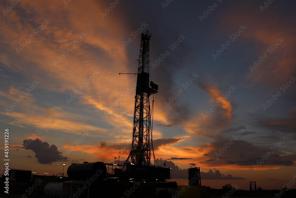 Oil and gas drilling rig at sunset in the Permian Basin of West Texas