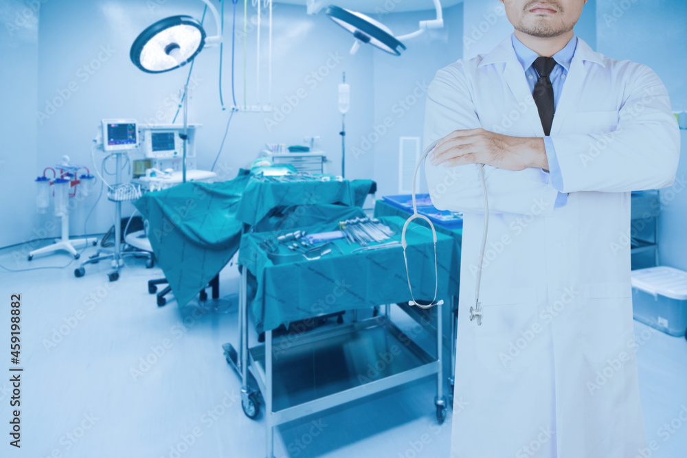 doctor pose arms crossed in operating room of a modern hospital doctor pose arms crossed in operating room of a modern hospital