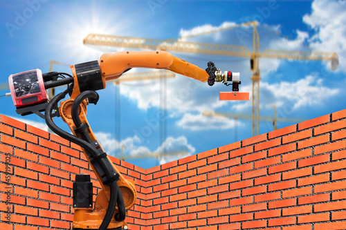 Automatics bricklayer robot working for building brick wall in construction site .concept of robotic technologies in construction industry.