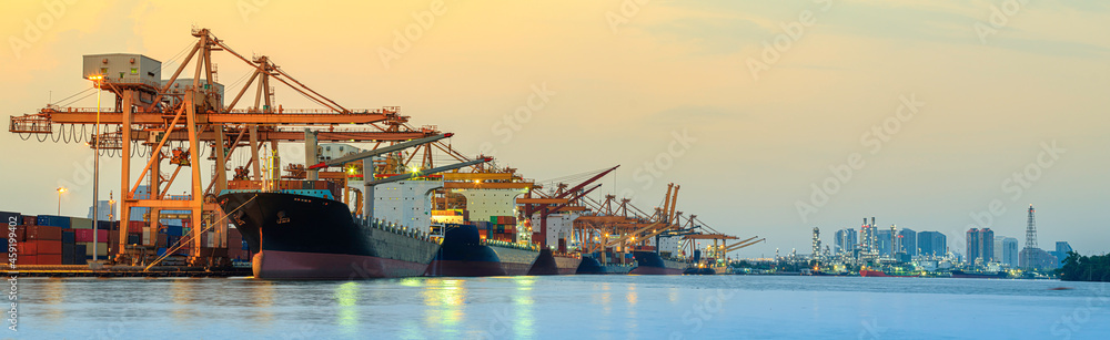Panorama image of container cargo ship with ports crane bridge in harbor and refinery industrial at night logistics and transportation concept - obrazy, fototapety, plakaty 