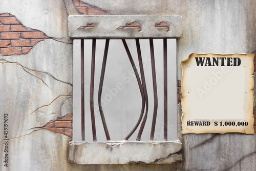 Foto Bent jail bars after a prison break with wanted reward billboard