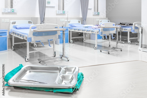 Fototapeta Naklejka Na Ścianę i Meble -  Equipment tools for surgeons who need to operate a patient in an operation room arranged on a table for a surgery of surgeon in the ward of hospital