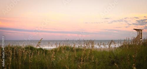 Fototapeta Naklejka Na Ścianę i Meble -  Lifeguard Stand Against a Pastel Sky