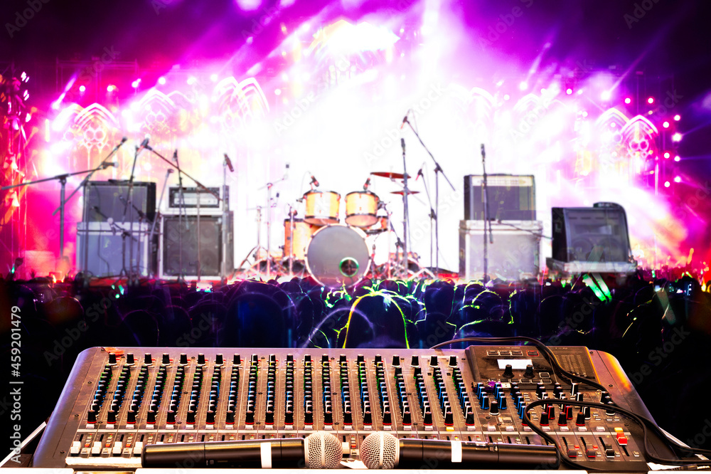 Professional audio mixer controls music in concert
