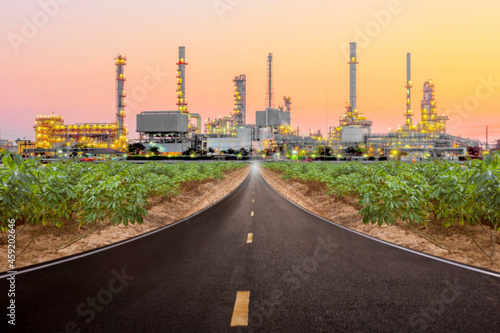 blur image of highway to petrochemical oil refinery in sunrise