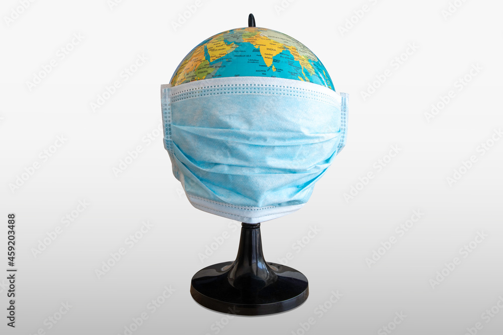 Mask on earth to protect the corona virus epidemic COVID-19. concept of coronavirus quarantine and protection isolated on white background with clipping path Mask on earth to protect the corona virus epidemic COVID-19. concept of coronavirus quarantine and protection isolated on white background with clipping path