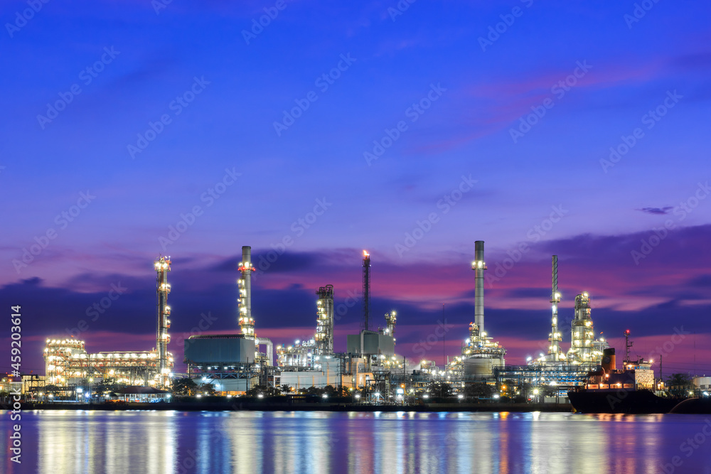 Oil refinery industrial plant at twilight Oil refinery industrial plant at twilight