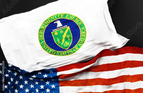 Flag of the United States Department of Energy along with a flag of the United States of America as a symbol of a connection between them, 3d illustration photo