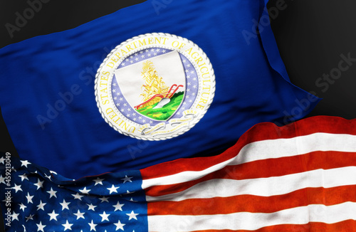 Flag of the United States Department of Agriculture along with a flag of the United States of America as a symbol of a connection between them, 3d illustration