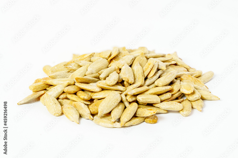 A pile of peeled sunflower seeds isolated on white background. Close-up of sunflower seeds isolated.