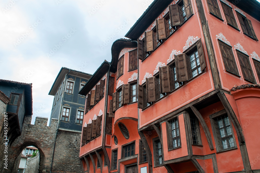 Row of ancient houses and Hisar Kapia gate in old town Row of ancient houses and Hisar Kapia gate in old town