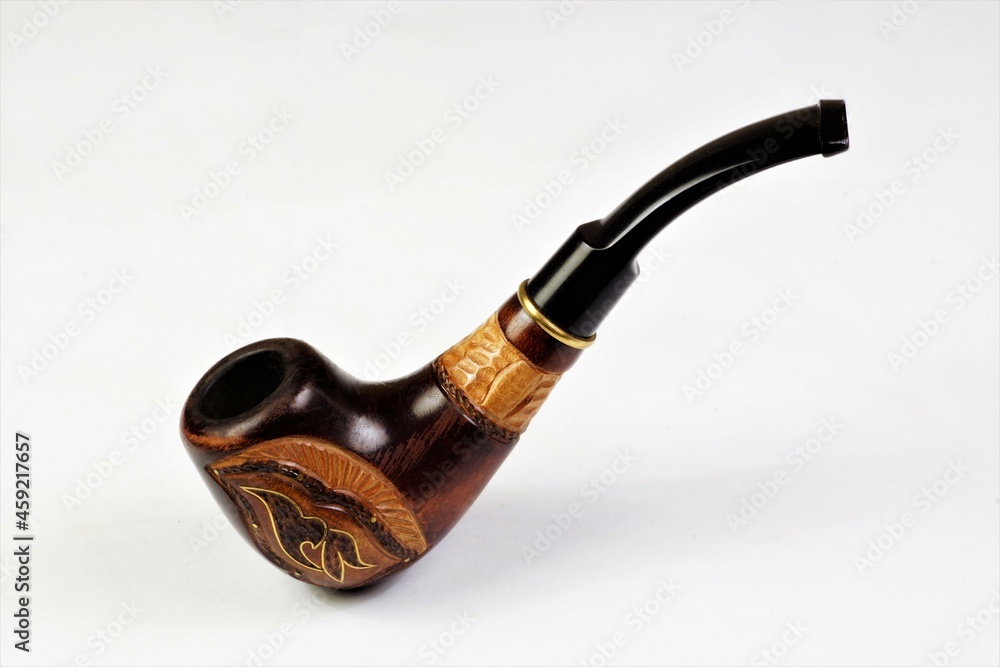 Smoking pipe, isolated on a white background. A device for ritual tobacco smoking.