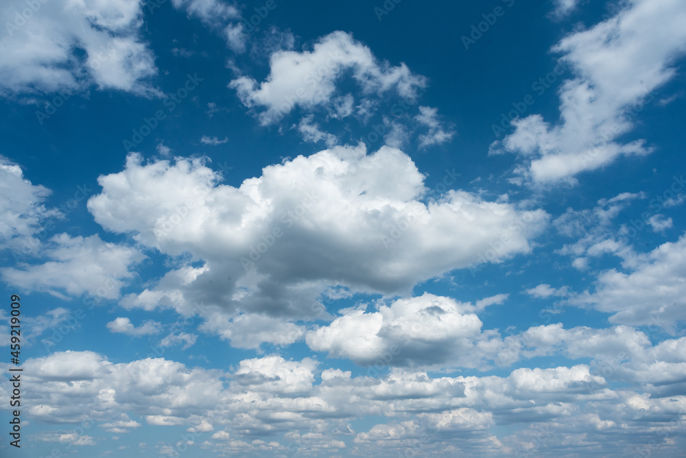 Blue cloudy sky abstract background. Cloudscape. Blue cloudy sky abstract background. Cloudscape.