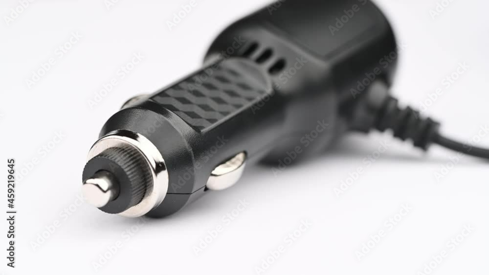 Close up of the black cigarette lighter for dashboard camera 12 volt equipment 4k and full HD video isolated on white background. Close up of the black cigarette lighter for dashboard camera 12 volt equipment 4k and full HD video isolated on white background.