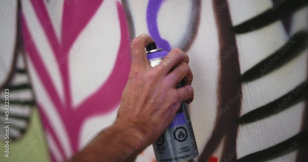 spray painting a wall mural Stock Video Adobe Stock