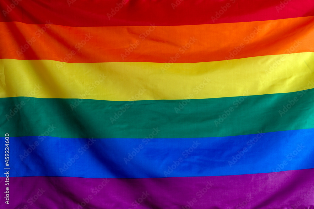 gay symbol rainbow flag waving in wind Stock Photo | Adobe Stock