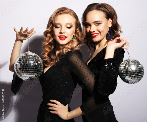 party and people concept: Party girls with disco balls