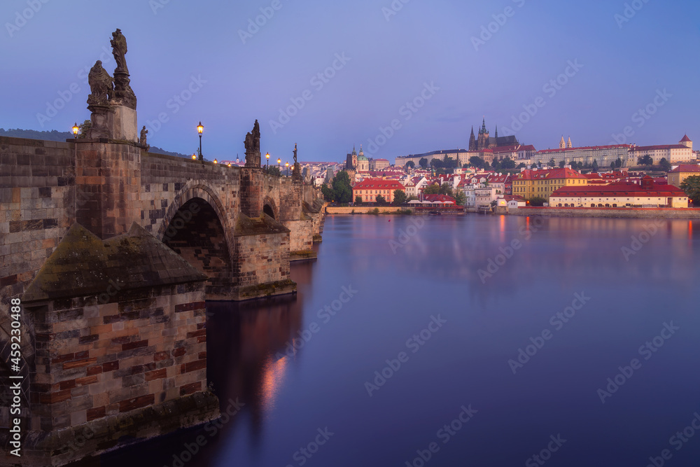 Beautiful view over Charles Bridge (Karluv Most) and Prague Castle (Hrad) on a sunrise in Prague, Czech Republic