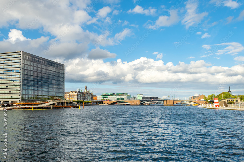 Beautiful modern buildings on the bank of the canal in Copenhagen, Denmark. Beautiful clouds. Contemporary European architecture. Architecture.