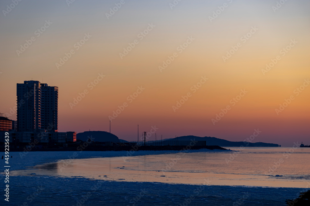 Vladivostok, Russia. Urban landscape on the background of sunset.