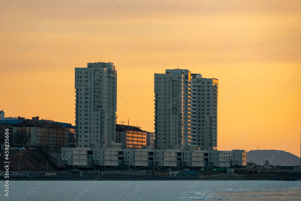 Vladivostok, Russia. Urban landscape on the background of sunset.