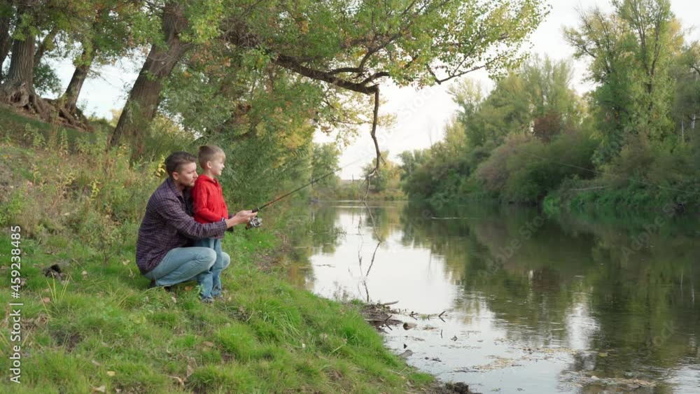 Dad teaches son to fish Dad teaches son to fish