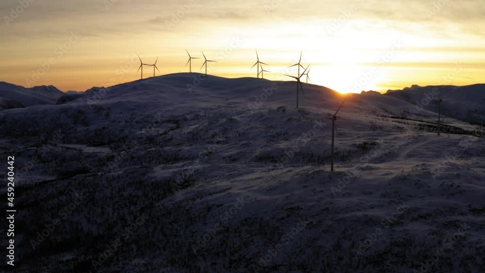 Video of steel wind turbines spinning with nature power getting renewable and alternative electricity,aerial view of scandinavian rural ecological station with wind generators in evening dusk
Video of steel wind turbines spinning with nature power getting renewable and alternative electricity,aerial view of scandinavian rural ecological station with wind generators in evening dusk