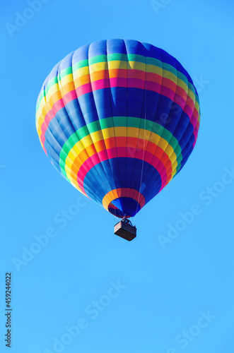 Colorful air balloon on blue sky background