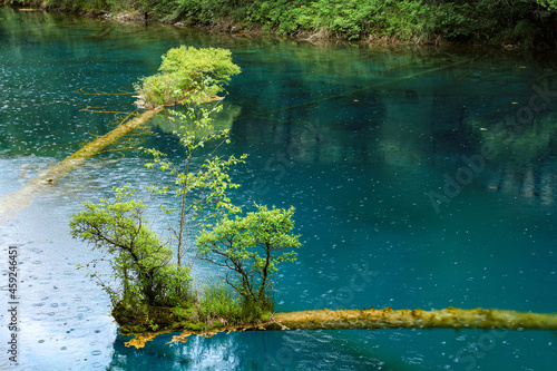 Ultramarine water in the travertine pools of the reserve