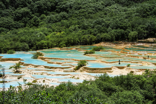 Ultramarine water in the travertine pools of the reserve