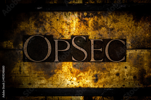 OpSec text on textured grunge copper and vintage gold background