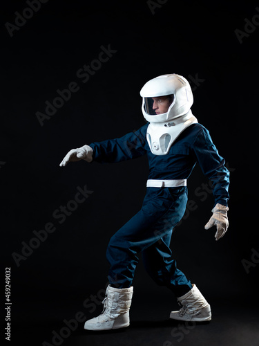 An astronaut walks in low-gravity conditions. The hero