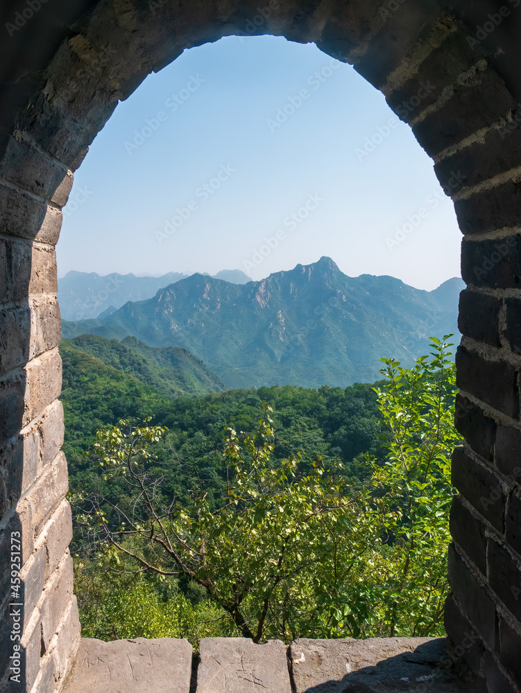 Obraz premium see through from window of a watchtower from the great wall of China at Mutianyu near Beijing, China, Asia, stock photography