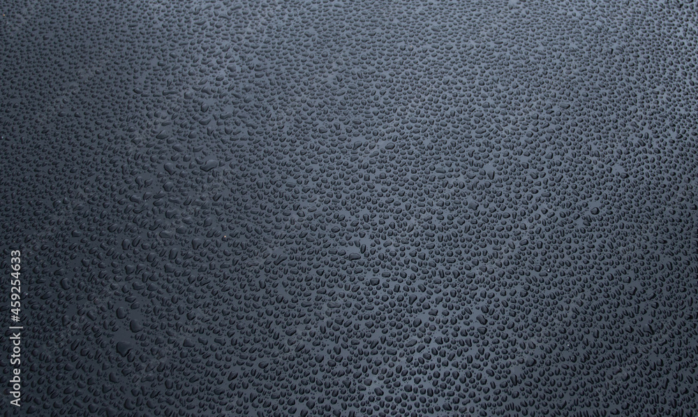 many small drops of water on a black metal background, many small drops of water on a black metal background,