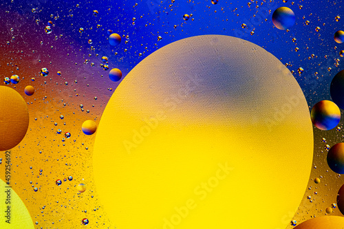 Abstract colorful background of oil circles. Oil in the water surface circles  water foam and oil bubbles.