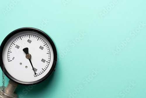 close up of pressure gauge on green table background