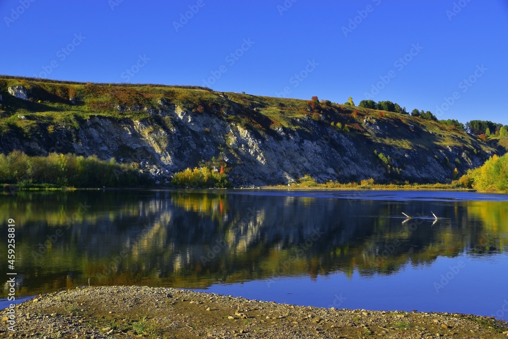 Grekhovskaya Mountain made of gypsum and anhydrite in autumn decoration (Western Urals, Russia)